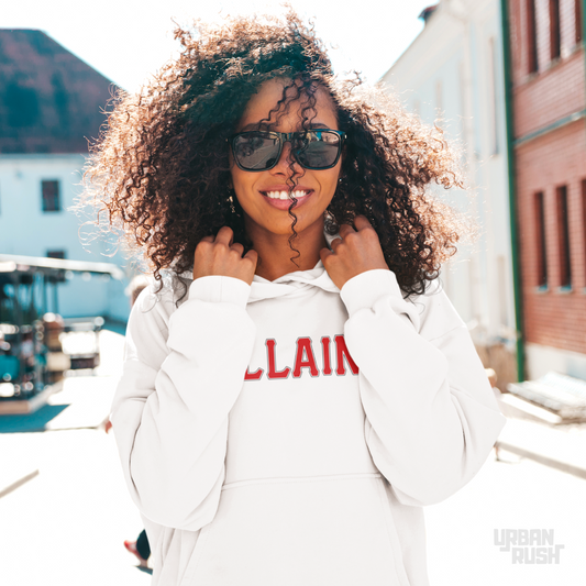 Woman wearing a white hoodie with red text, sunglasses, and a blurred background