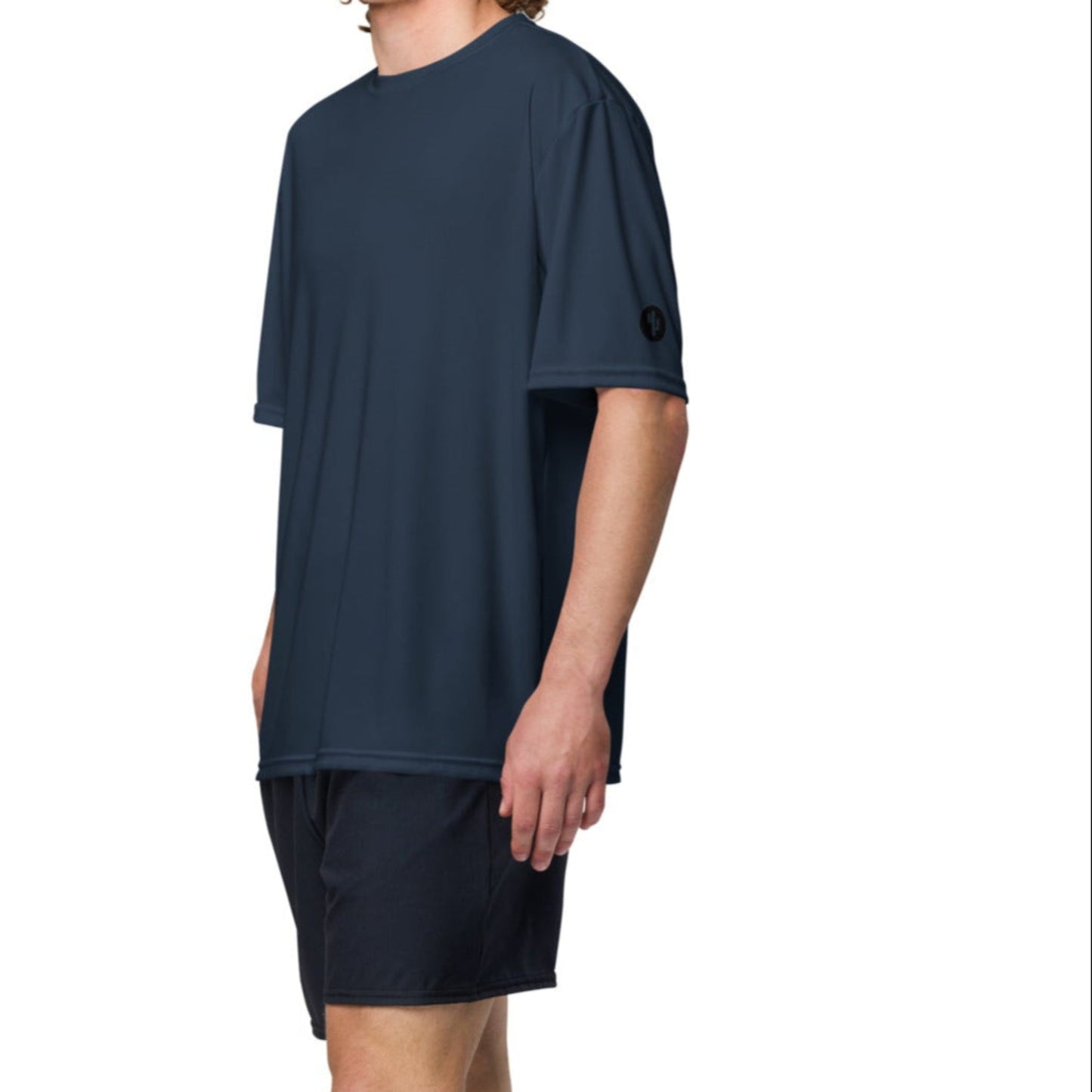 Man wearing a navy blue t-shirt and shorts on a white background