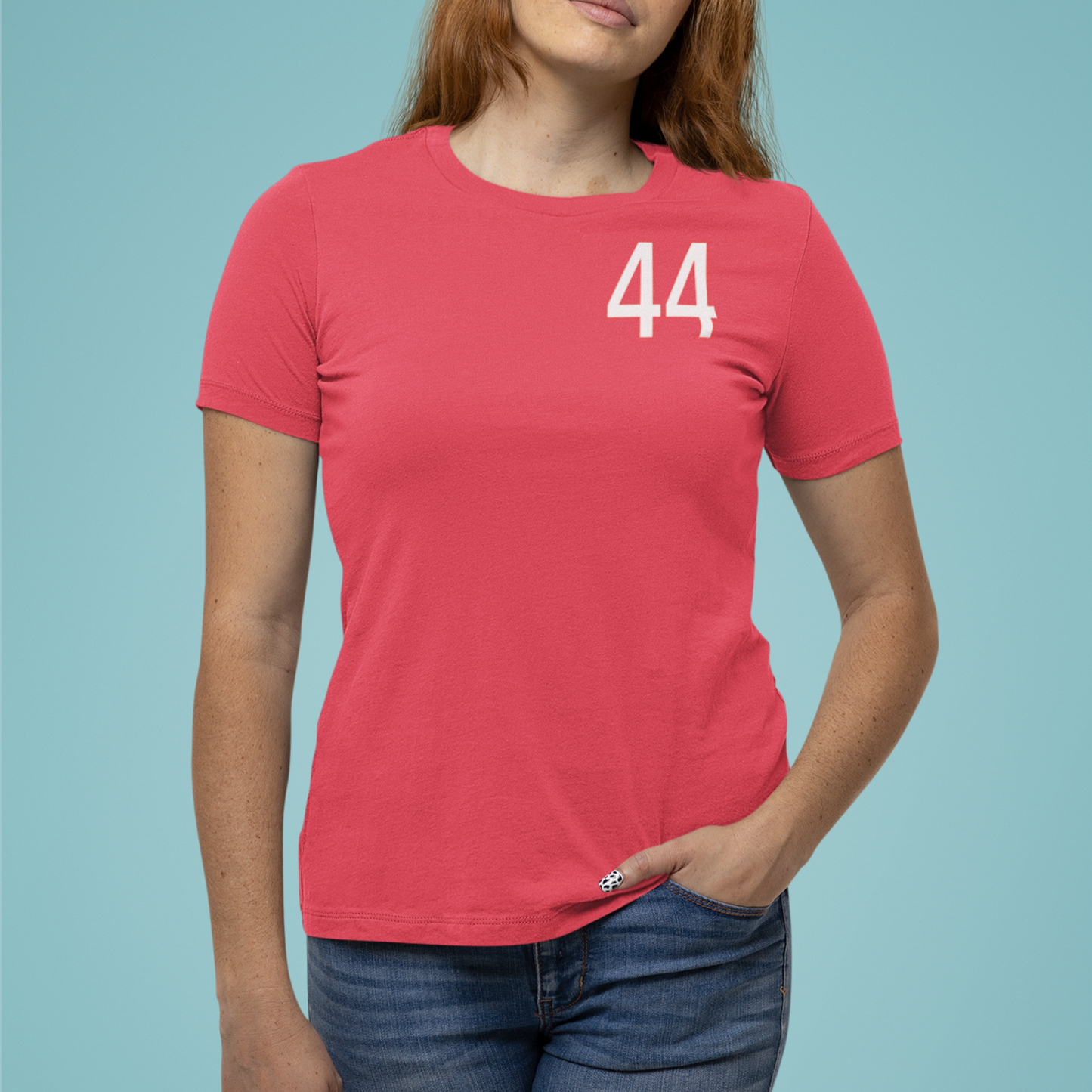 Person wearing a red t-shirt with the number 44 on a light blue background