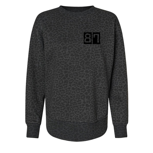 Dark gray patterned sweatshirt with a black logo on a white background