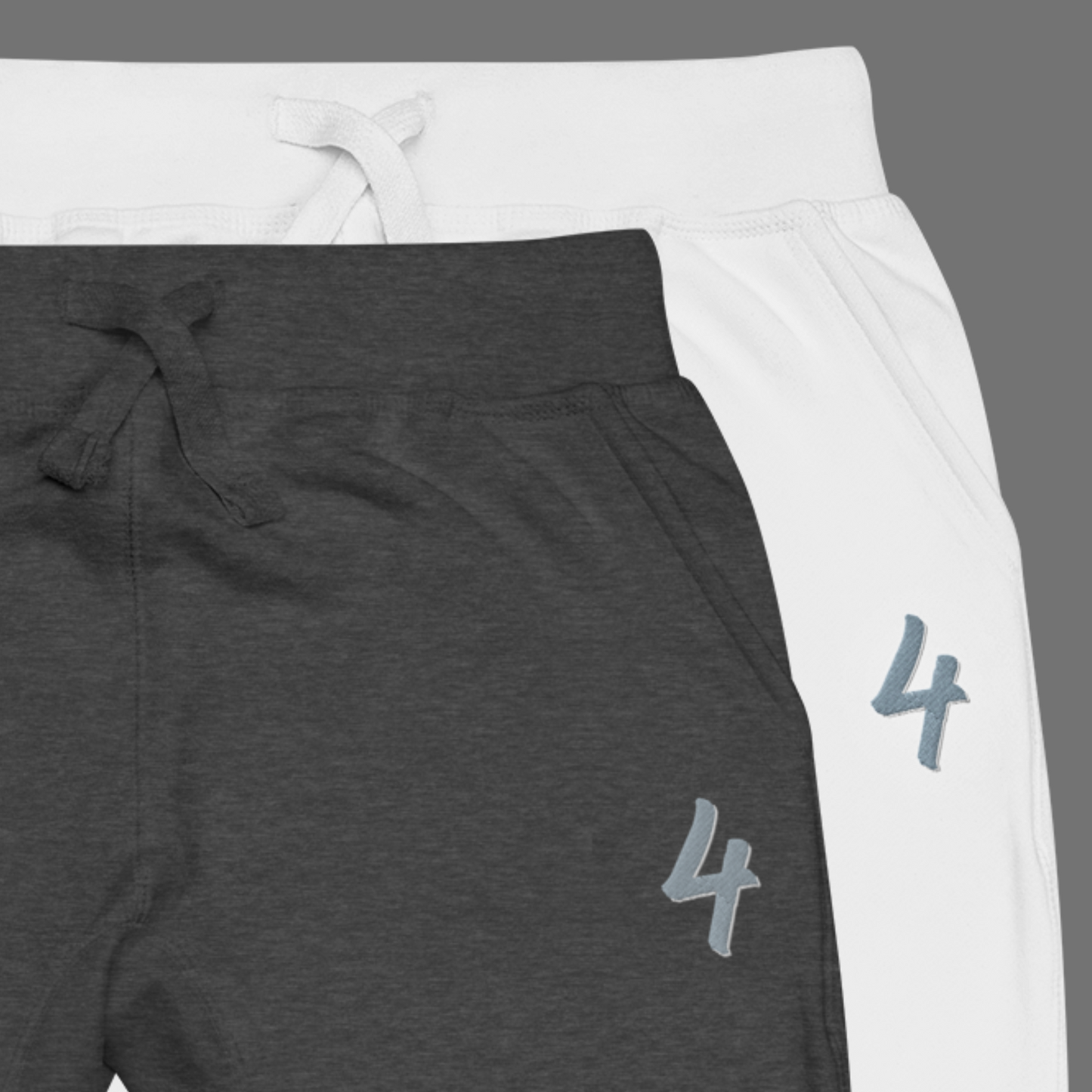 two pairs of joggers in gray and white with number '4' embroidered.