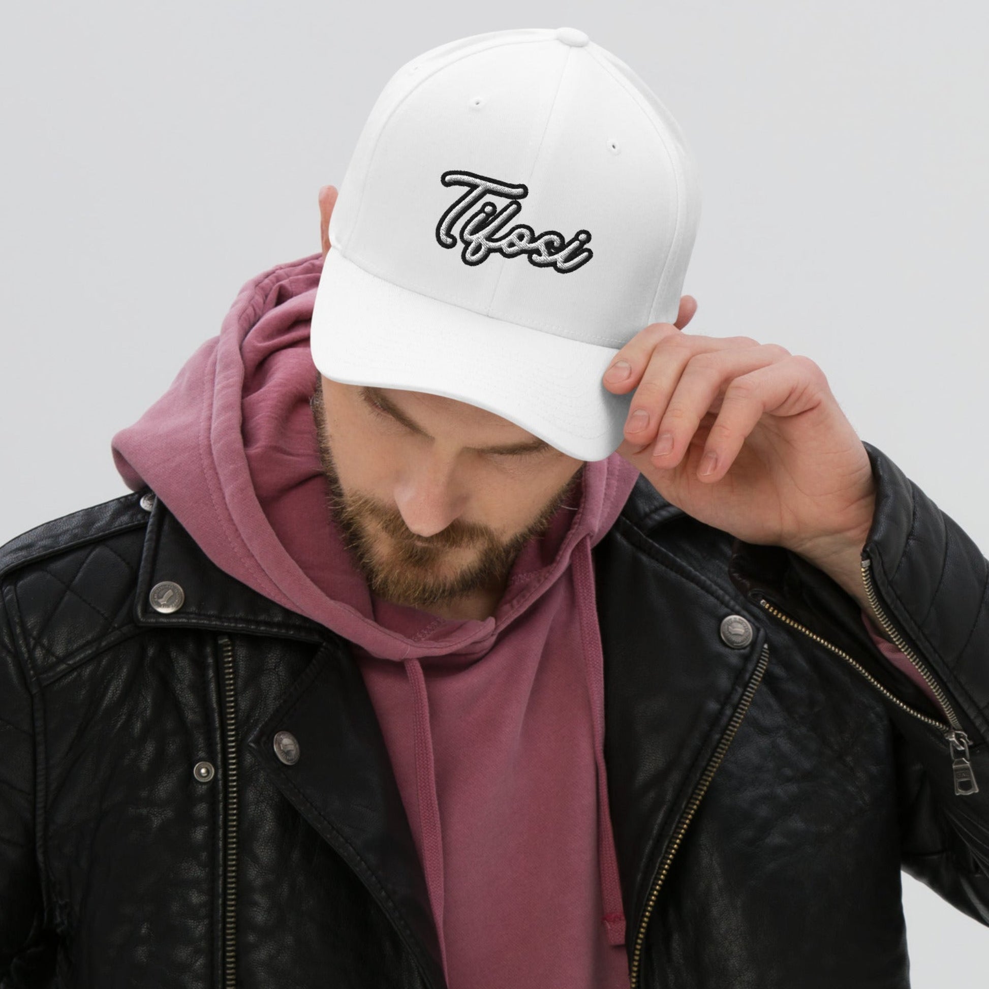 Model wearing a white cap with Tifosi embroidery.