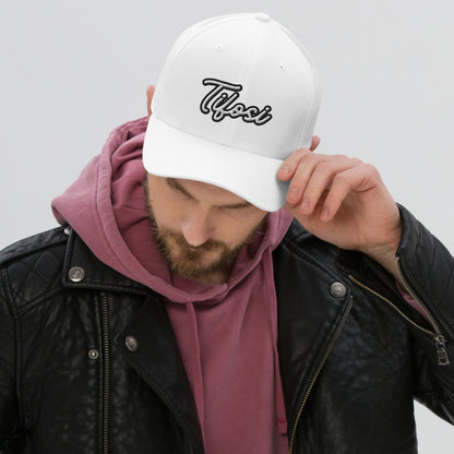 Model wearing a white cap with Tifosi embroidery.