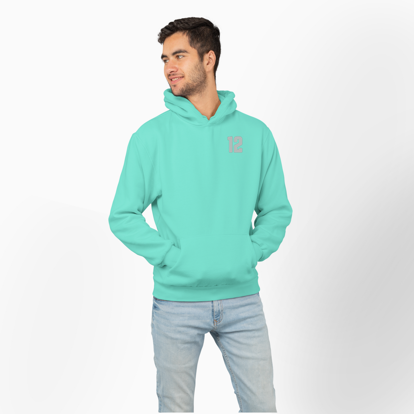 Man wearing a mint hoodie with a small 12 on a white background