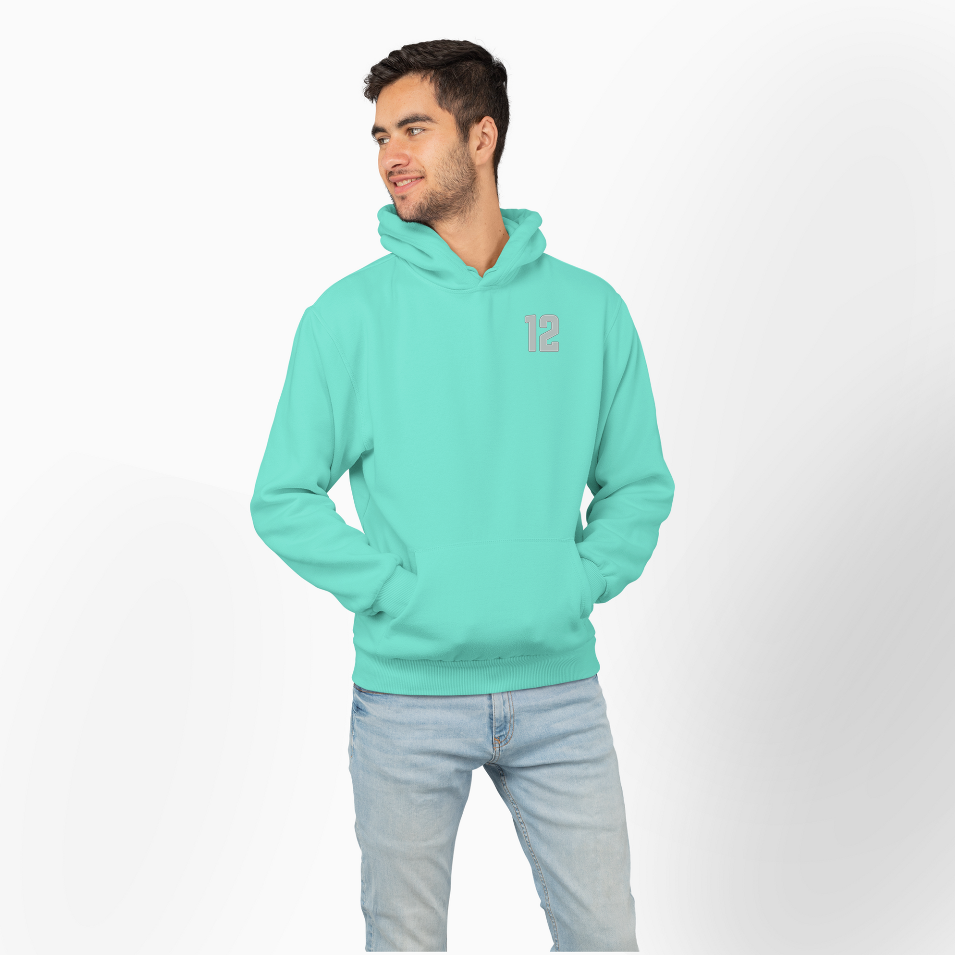 Man wearing a mint hoodie with a small 12 on a white background