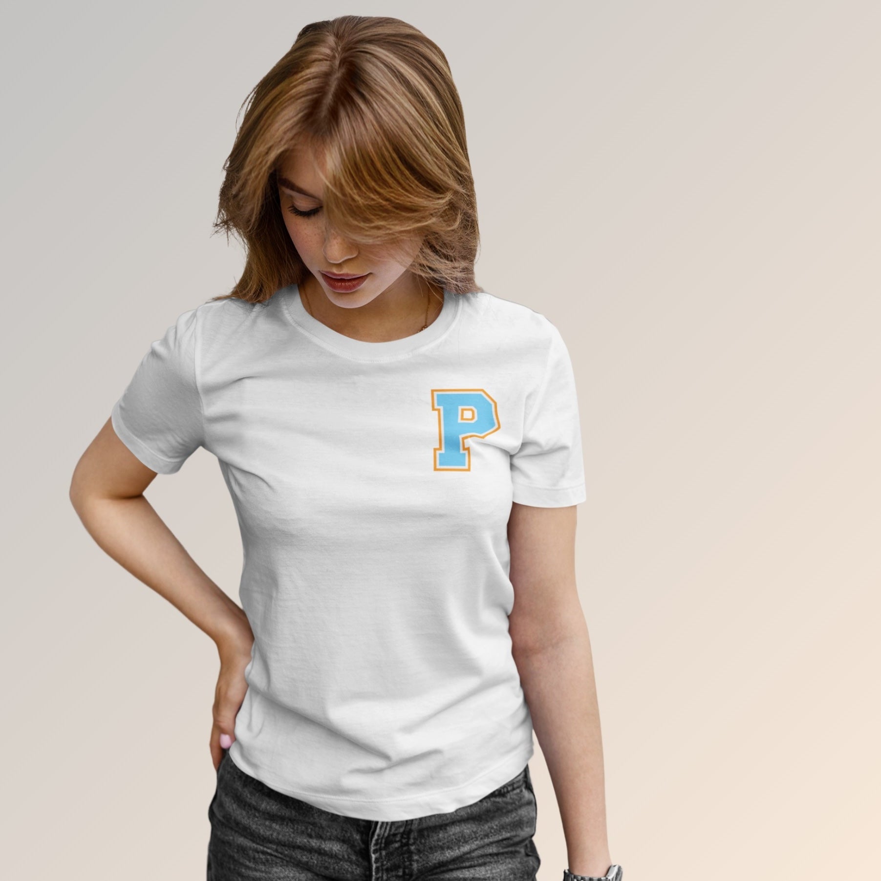 Model wearing a white t-shirt with a letter 'P' on a plain background