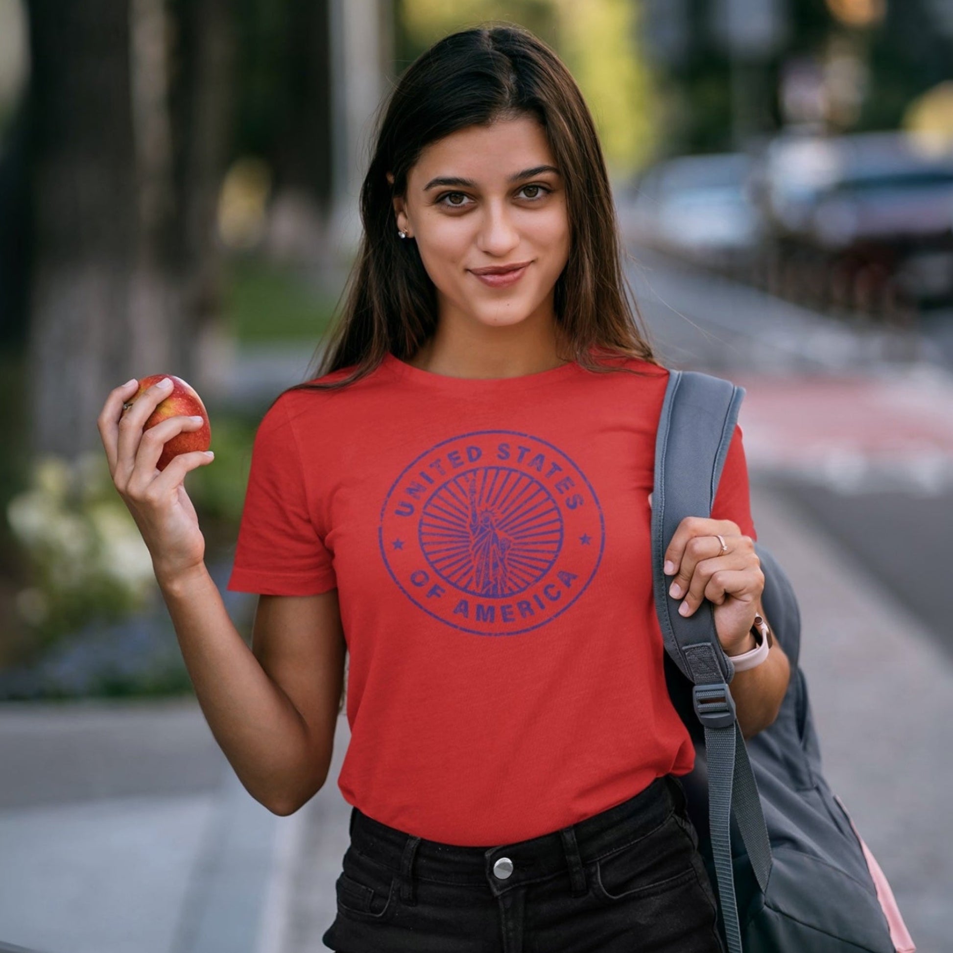 Woman in a red USA t-shirt with a graphic design.