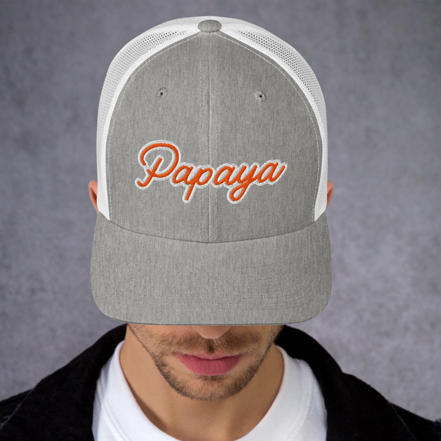 Person wearing a gray and white cap with 'Papaya' text on a dark background