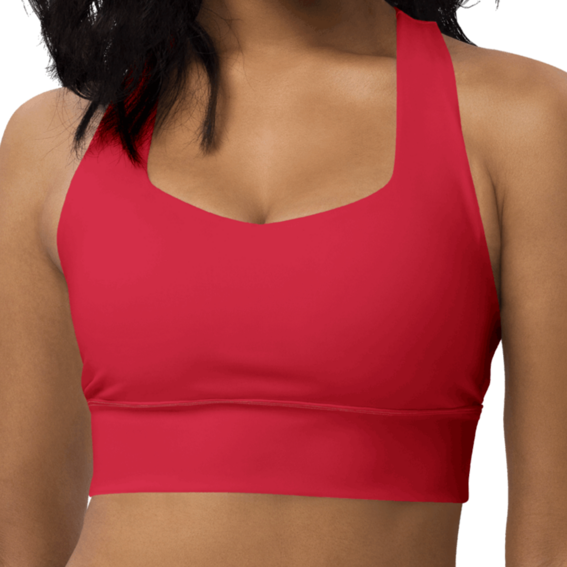Red sports bra worn by a person on a white background