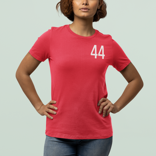 Person wearing a red t-shirt with the number 44 on a light gray background